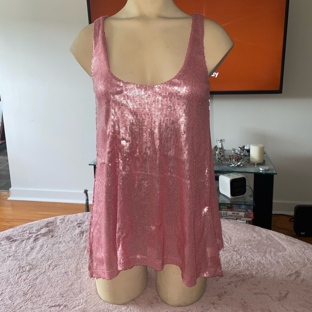 Shiny babydoll shirt. Stunning with a pair of heels and jeans.